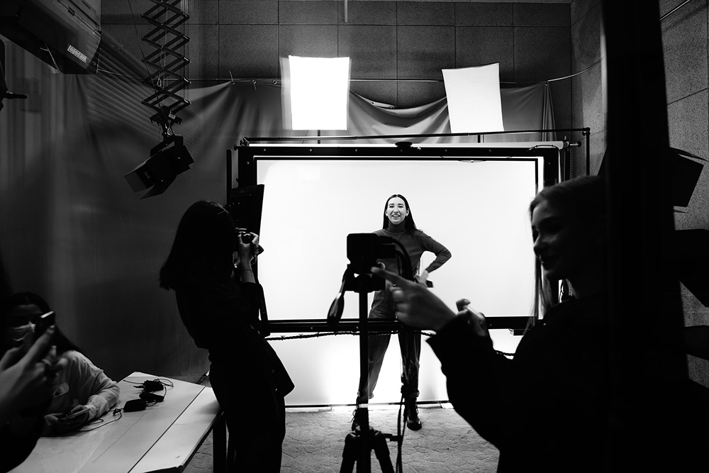 Photographers working in a well-equipped studio space